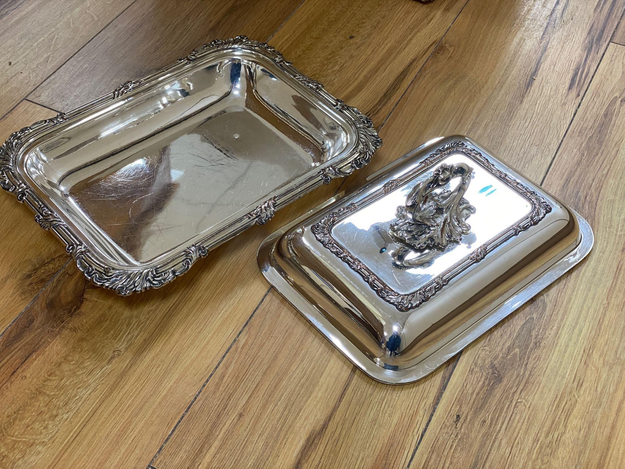 A silver sauce jug, a pair of Victorian plated entree dishes with covers and other plated wares